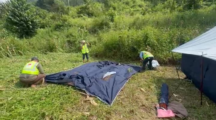 Unfolding the tents on the site