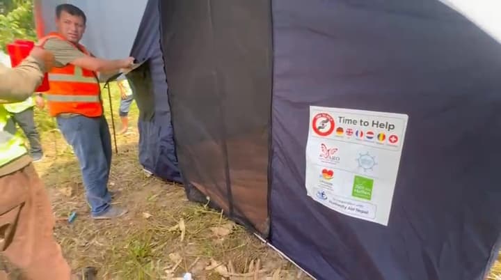 Final adjustments to a tent