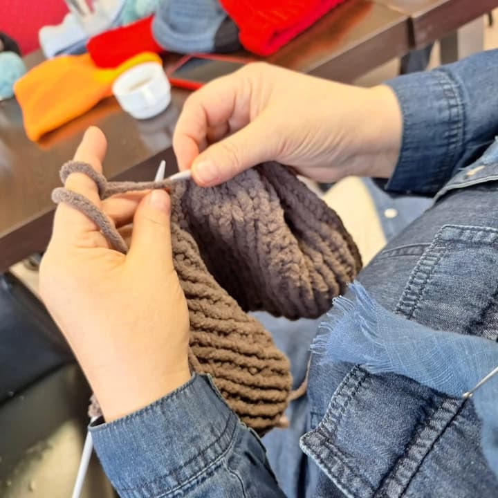 A brown hat being knitted