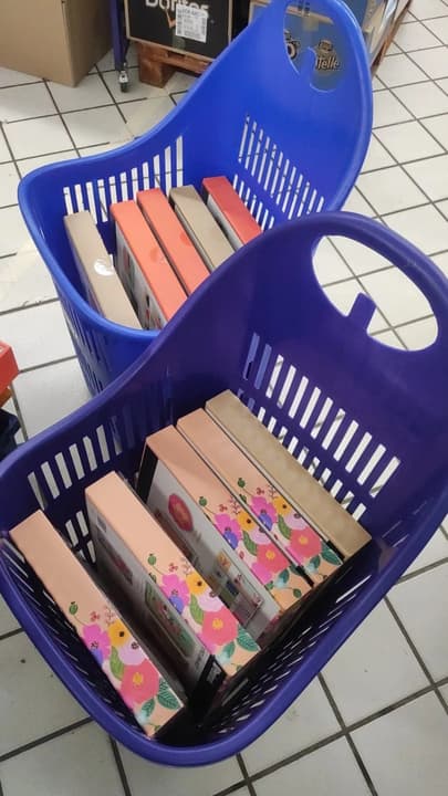 Shopping for the gifts: stationery sets in flower-patterned boxes, in shopping baskets
