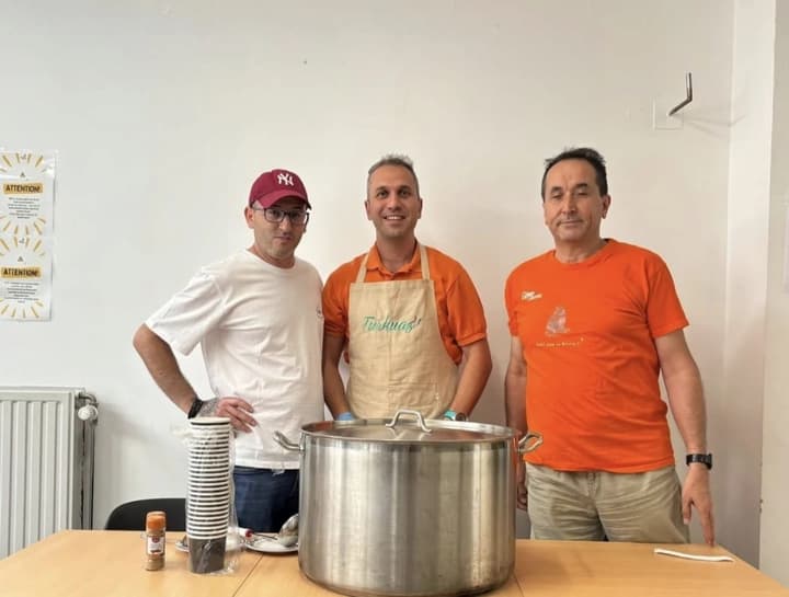 Three of our volunteers by the pot of aşure